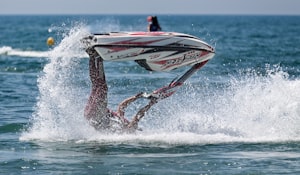Jetski and stunt rider upside down. Get an Insurance Quote for your boat or jetski. - www.The-MillerInsuranceAgency.com.