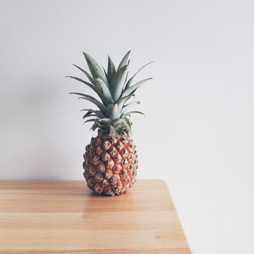 a pineapple sitting on a table. 