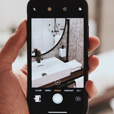 Phone taking a picture of a sink