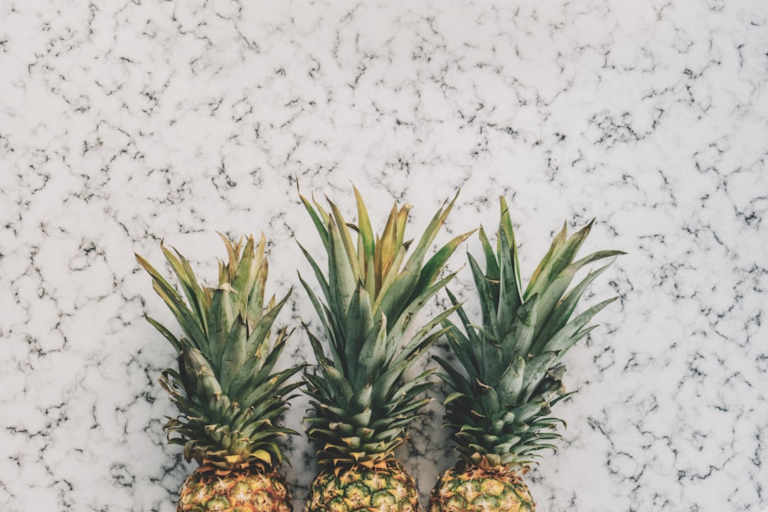 free stock photo of 3 pineapples on marble