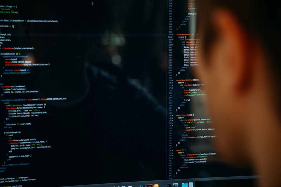a person looking at code on a computer screen