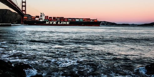 An ocean vessel is transporting thousands of shipping containers.