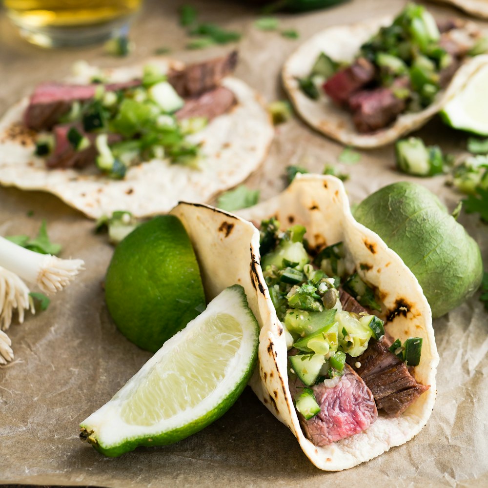 beef tacos served alongside limes cook it now